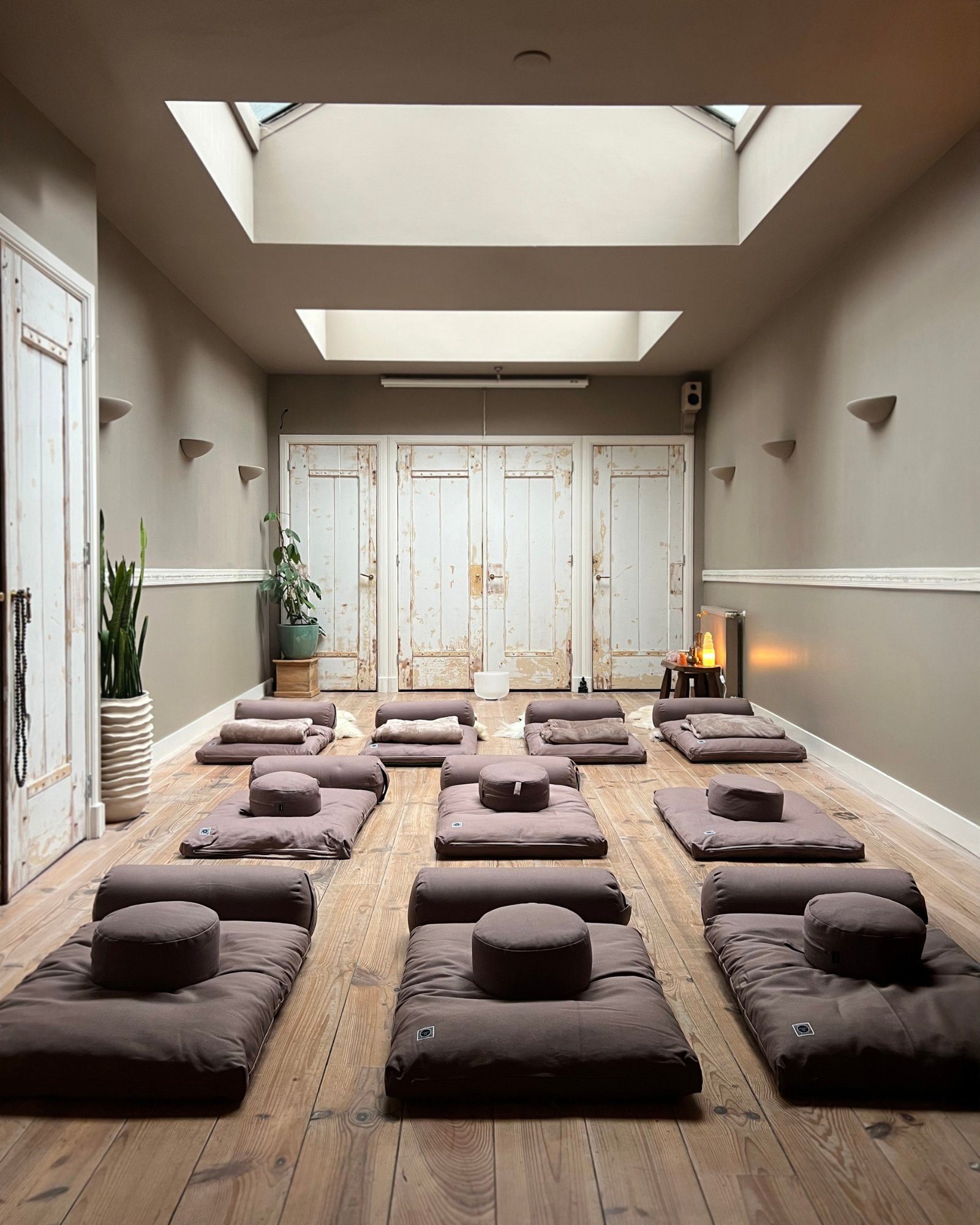 Meditation cushions arranged on the sanctuary floor