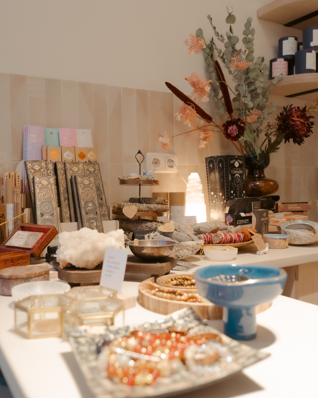 The SØSOUL Shop table with incense, crystals and flowers