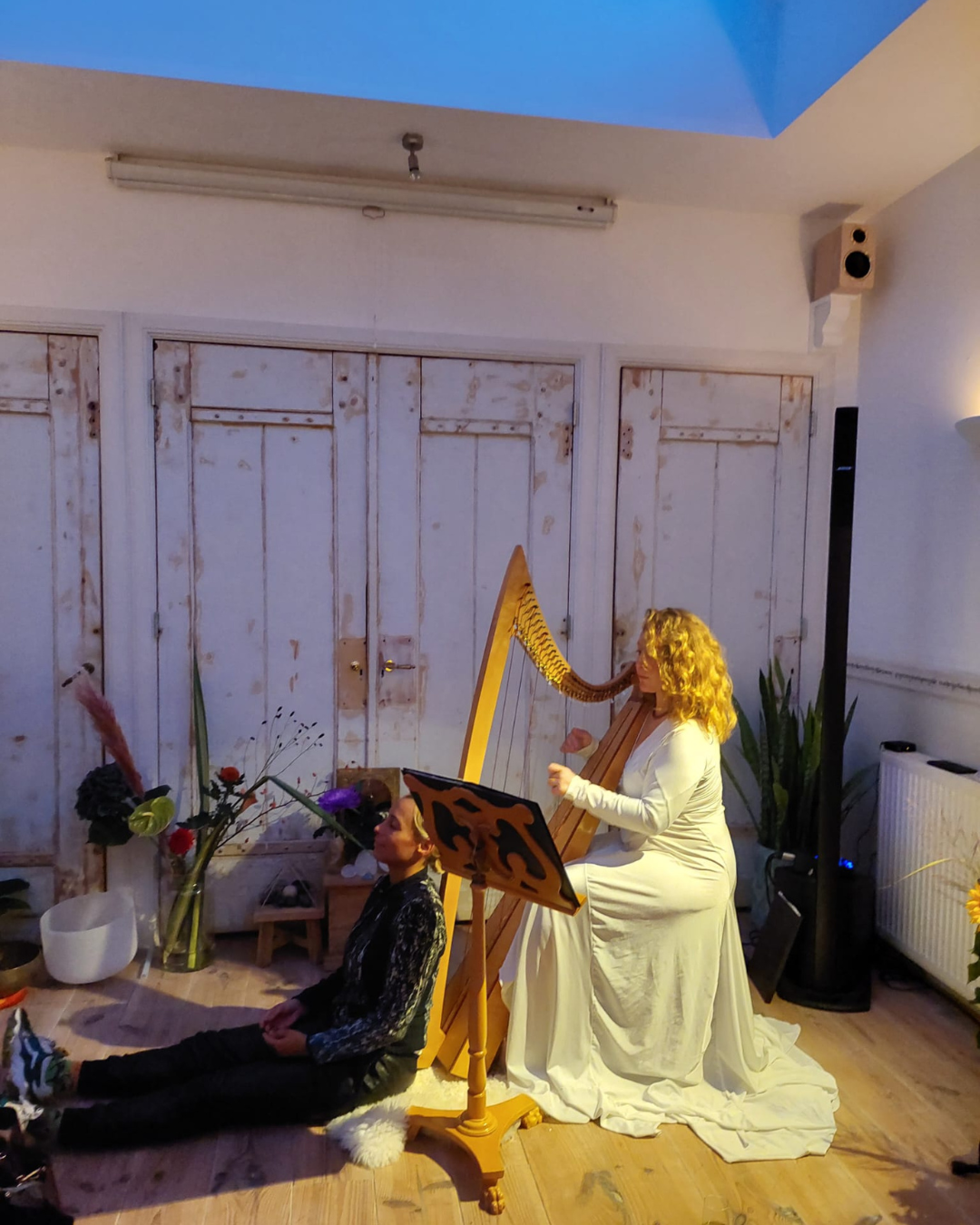 A harpist playing during a blessing in the sanctuary